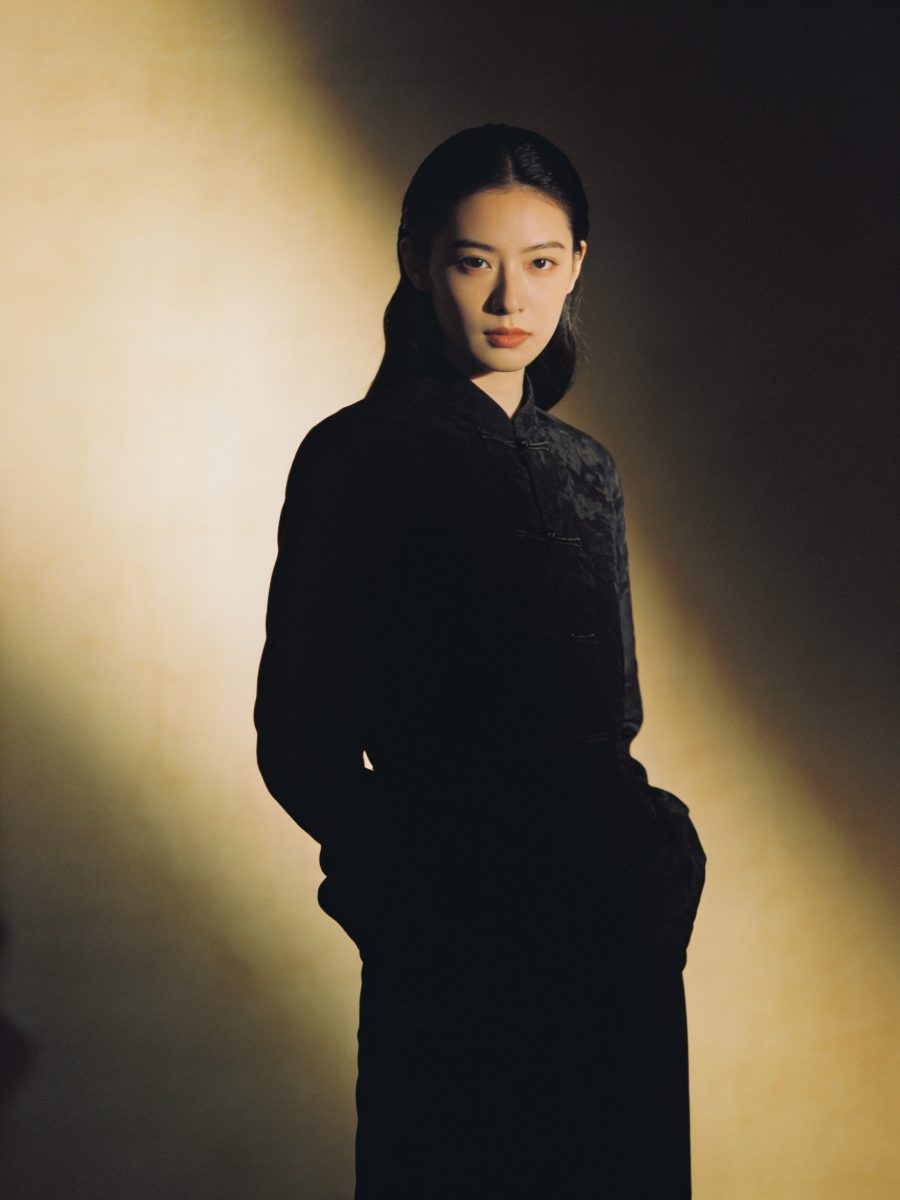 The Noir — a woman in deep tonal darks, guarded and mysterious in warm light